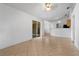 Spacious living area featuring neutral tile floors and sliding glass doors that lead to outdoor space at 144 Fort Smith Blvd, Deltona, FL 32738