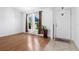 Bright living room boasts wood floors, large windows, and a welcoming entrance at 144 Fort Smith Blvd, Deltona, FL 32738