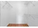 Empty walk-in closet with wire shelving and laminate floors at 144 Fort Smith Blvd, Deltona, FL 32738