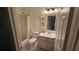 Clean bathroom featuring a vanity with sink, mirror, toilet, and a shower-tub combo at 148 Peregrine Ct, Winter Springs, FL 32708