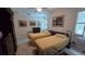Comfortable bedroom with two beds, tasteful artwork, and ample natural light at 148 Peregrine Ct, Winter Springs, FL 32708