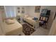 Bedroom featuring two twin beds, window with blinds and a bookcase at 148 Peregrine Ct, Winter Springs, FL 32708