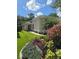 Inviting home exterior showcases a well-manicured lawn, vibrant landscaping, and charming curb appeal at 148 Peregrine Ct, Winter Springs, FL 32708