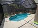 The inviting screened pool offers a refreshing escape, enhanced by the surrounding privacy screen and lush landscaping at 148 Peregrine Ct, Winter Springs, FL 32708