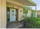 Front entry featuring a decorative glass door and a tiled porch at 1511 Center Ave, Holly Hill, FL 32117