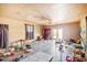 Spacious living room with light wood floors, fan and natural light at 1511 Center Ave, Holly Hill, FL 32117