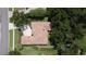 Aerial view of a home with a clay tile roof and lush greenery at 1679 Shadowmoss Cir, Lake Mary, FL 32746