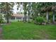 Beautiful home featuring a spacious backyard with well-manicured lawn and white picket fence at 1679 Shadowmoss Cir, Lake Mary, FL 32746