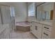 Bathroom featuring a glass shower, marble countertop sink, and a soaking tub at 1679 Shadowmoss Cir, Lake Mary, FL 32746