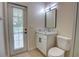 Bathroom with a glass shower, and a door leading to the exterior at 1679 Shadowmoss Cir, Lake Mary, FL 32746