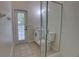 Bathroom with glass shower, and a door leading to the exterior at 1679 Shadowmoss Cir, Lake Mary, FL 32746