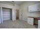 Bedroom with neutral paint, carpet, a closet, and a built in desk area at 1679 Shadowmoss Cir, Lake Mary, FL 32746