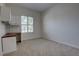 This bedroom features neutral carpet and paint, bright windows, and a built in desk area at 1679 Shadowmoss Cir, Lake Mary, FL 32746