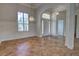 Welcoming entryway with tile floors, chandelier, and view of a bright living space at 1679 Shadowmoss Cir, Lake Mary, FL 32746
