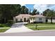 Charming single-story home with a well-manicured lawn and a welcoming driveway at 1679 Shadowmoss Cir, Lake Mary, FL 32746