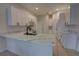 Beautiful kitchen with white cabinets, stone countertops, and a stainless steel microwave at 1679 Shadowmoss Cir, Lake Mary, FL 32746