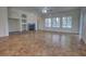 Inviting living room with a tiled fireplace, neutral walls, and natural light at 1679 Shadowmoss Cir, Lake Mary, FL 32746