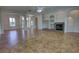 Bright living room with tile flooring, a fireplace, and open access to entry at 1679 Shadowmoss Cir, Lake Mary, FL 32746