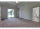 Large main bedroom with a private bathroom and sliding glass doors to the backyard at 1679 Shadowmoss Cir, Lake Mary, FL 32746