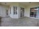 Covered patio featuring tile flooring and views of the fenced backyard at 1679 Shadowmoss Cir, Lake Mary, FL 32746