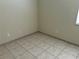 Neutral bedroom with tile flooring and base trim at 2149 Mallard Creek Cir, Kissimmee, FL 34743