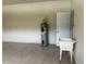 Spacious garage featuring tile floors, utility sink, and water heater installation at 2149 Mallard Creek Cir, Kissimmee, FL 34743