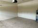 View of the garage showing the tile flooring, water heater and block wall construction at 2149 Mallard Creek Cir, Kissimmee, FL 34743
