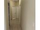 Hallway featuring tile flooring and white doors at 2149 Mallard Creek Cir, Kissimmee, FL 34743