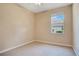 Neutral bedroom featuring carpet and a window view of the outdoors at 216 Homestretch Blvd, Deland, FL 32724
