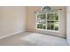 Bright bedroom with carpet flooring, natural light, and a large window at 216 Homestretch Blvd, Deland, FL 32724