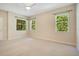 Bright bedroom featuring a ceiling fan, carpet floors and three windows with natural light at 216 Homestretch Blvd, Deland, FL 32724