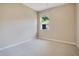 Neutral bedroom featuring carpet and a window view of the outdoors at 216 Homestretch Blvd, Deland, FL 32724