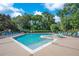 Large community pool with lounge chairs, umbrellas and spa at 216 Homestretch Blvd, Deland, FL 32724