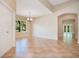 Spacious dining room featuring tile flooring and a large window with natural light and an archway to another room at 216 Homestretch Blvd, Deland, FL 32724