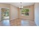 Neutral dining room with natural light and tile flooring at 216 Homestretch Blvd, Deland, FL 32724
