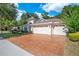 Charming home featuring a three-car garage and beautifully landscaped front yard at 216 Homestretch Blvd, Deland, FL 32724