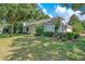 Well-manicured front lawn and attractive landscaping enhance curb appeal of this lovely home at 216 Homestretch Blvd, Deland, FL 32724