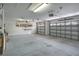 Spacious two car garage with white cinder block walls and two overhead doors at 216 Homestretch Blvd, Deland, FL 32724
