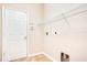 Laundry room featuring tile floors, shelving, and utility hookups at 216 Homestretch Blvd, Deland, FL 32724