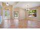 Bright and open living room featuring tile floors and an abundance of natural light at 216 Homestretch Blvd, Deland, FL 32724