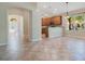 Open floor plan featuring tile floors and view of the kitchen with breakfast bar at 216 Homestretch Blvd, Deland, FL 32724