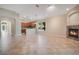 Open living area featuring tile floors, a fireplace, and kitchen access at 216 Homestretch Blvd, Deland, FL 32724