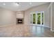 Bright and spacious living room featuring a fireplace, natural light and sliding glass doors at 216 Homestretch Blvd, Deland, FL 32724
