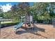 Community playground with slide, climbing structures, and safety mulch surface at 216 Homestretch Blvd, Deland, FL 32724