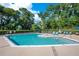 Sparkling community pool with lounge chairs and umbrellas for relaxing on sunny days at 216 Homestretch Blvd, Deland, FL 32724