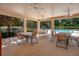 Covered poolside patio offers ample seating with tables and chairs, perfect for relaxing at 216 Homestretch Blvd, Deland, FL 32724