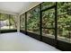 Bright, airy screened porch with views of the lush, green backyard at 216 Homestretch Blvd, Deland, FL 32724