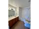 Spacious bathroom featuring a large vanity, mirror and shower at 2200 San Vittorino Cir # 102, Kissimmee, FL 34741