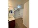 Well-lit bathroom with a tub, vanity, and tile flooring at 2200 San Vittorino Cir # 102, Kissimmee, FL 34741