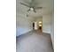 Neutral bedroom featuring a ceiling fan and ensuite bath at 2200 San Vittorino Cir # 102, Kissimmee, FL 34741